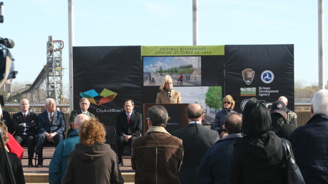 Speakers present in front of an audience